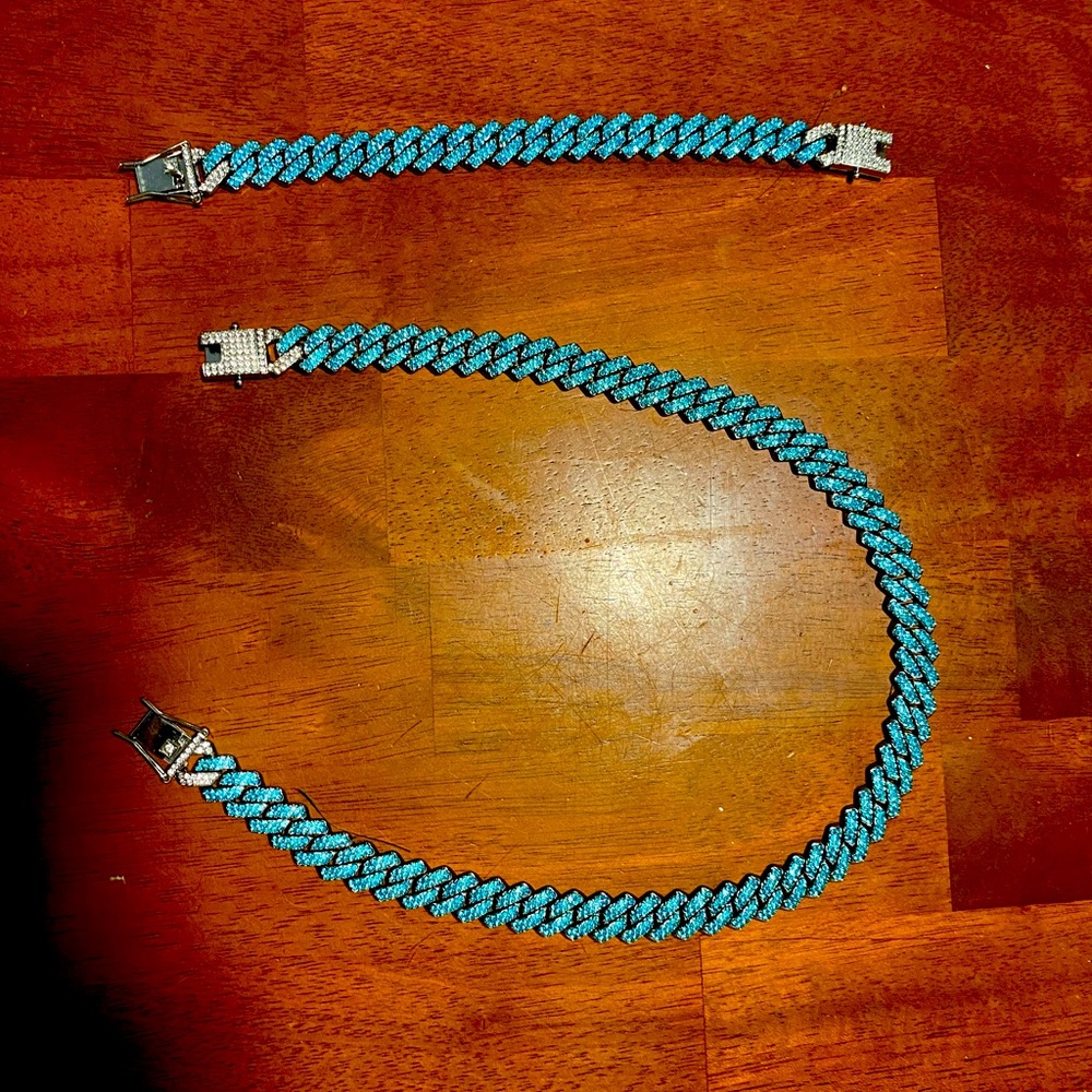 Blue chain and bracelet set iced or sold separately
